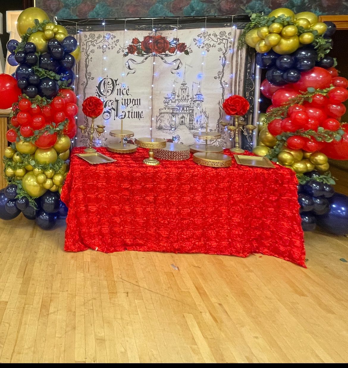 Fairy tale quinceañera backdrop with draped florals