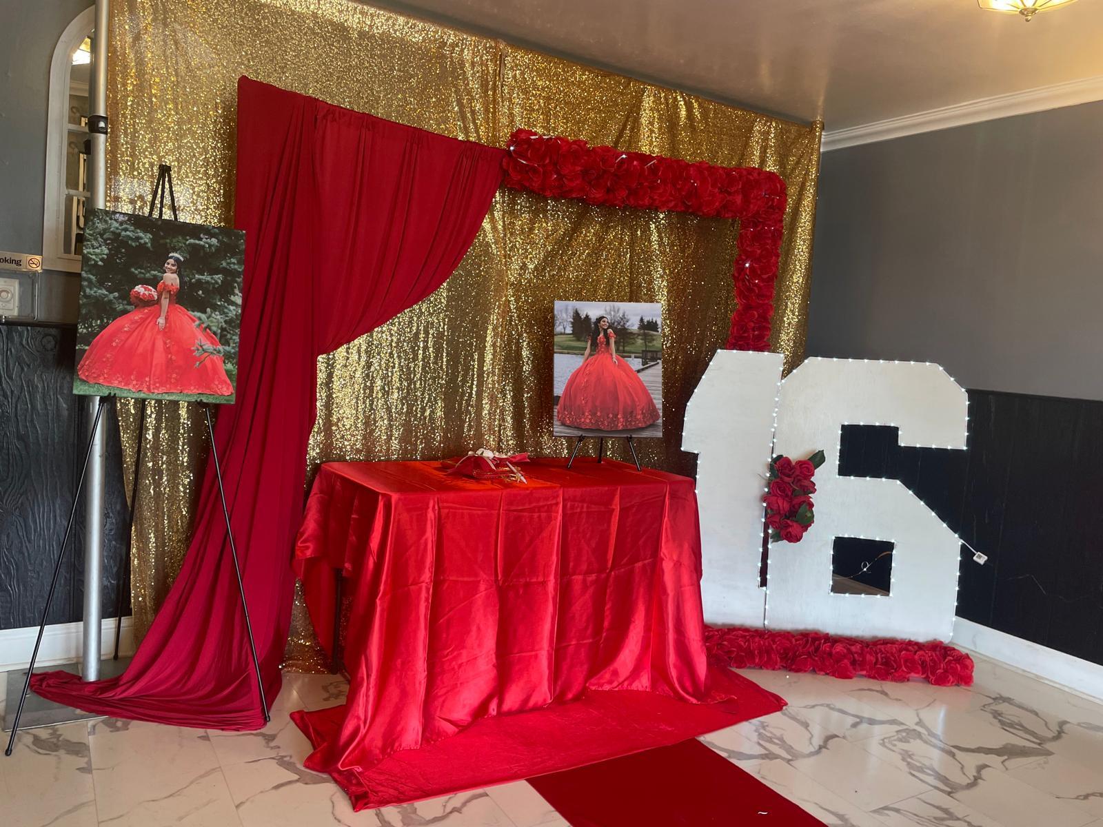 Dramatic quinceañera entrance backdrop with rose display