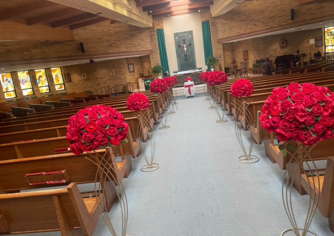 Church aisle with floral arrangements