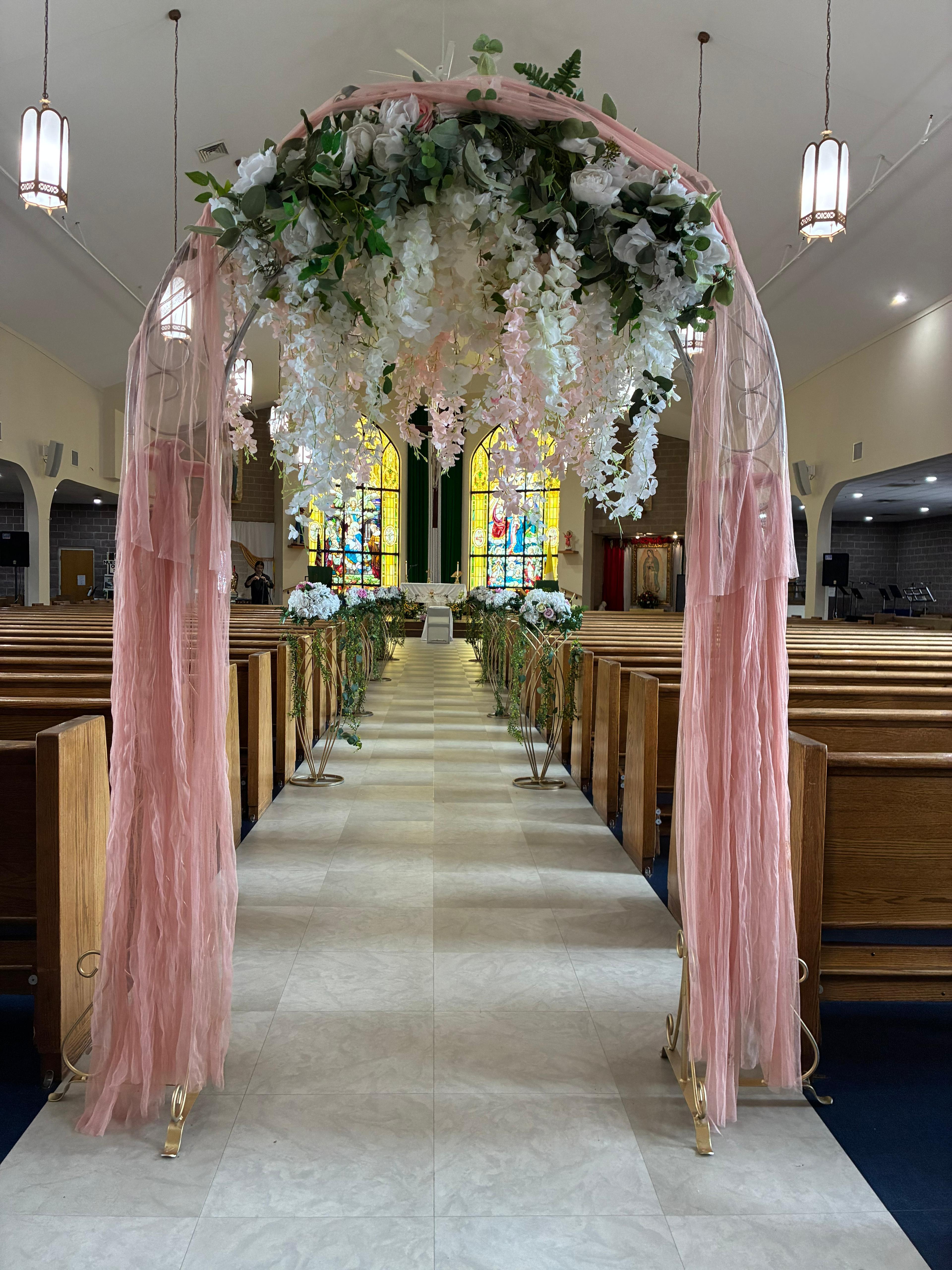 Church archway with pink tulle and flowers