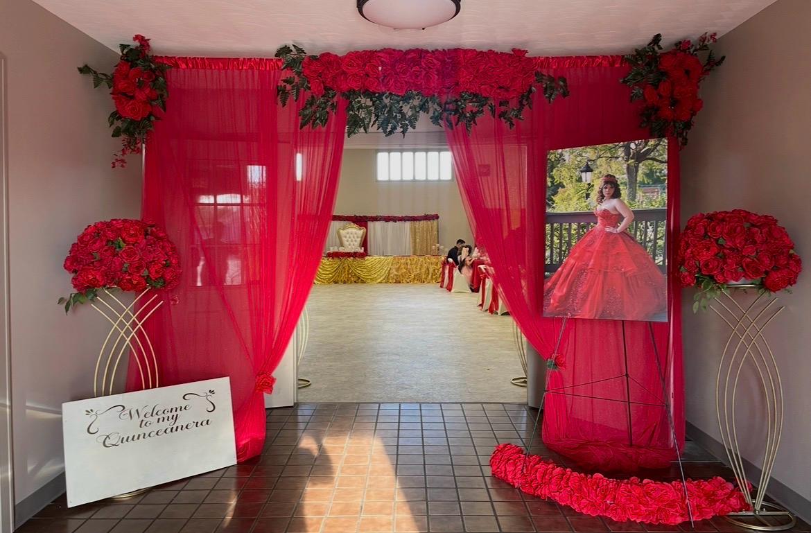 Grand quinceañera entrance with cascading roses