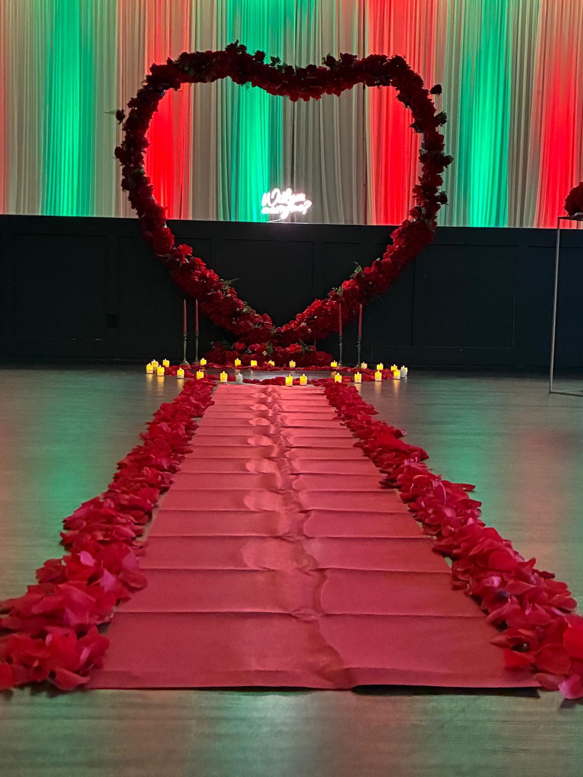 Elegant indoor wedding proposal heart arch